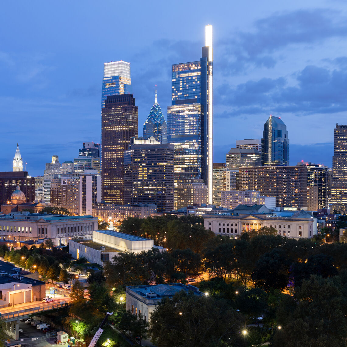 Philadelphia City Center and Business District Skyscrapers. Pennsylvania. Cloudy Blue Sky. Philadelphia Downtown. Evening Lights. Night Time.